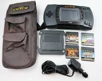 Atari - Console LCD Handheld Game - Lynx (ref. PAG-0400) + 4 Jeux + Sacoche Transport + Chargeur Voiture & Pare-Soleil