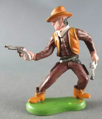 Britains Herald-  Cowboy - Footed 2 pistols advancing right leg (ref 60?)