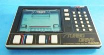 Casio - Handheld Game & Calculatrice - Turbo Drive MG-200 (occasion)