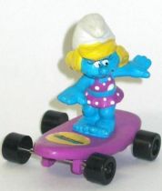 Hardee\'s Smurfette bathing dress on purple skateboard