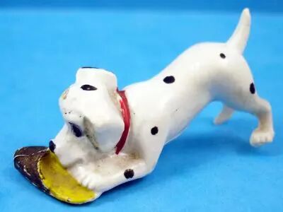 Les 101 dalmatiens - Figurine Jim - B�b� jouant avec une pantoufle
