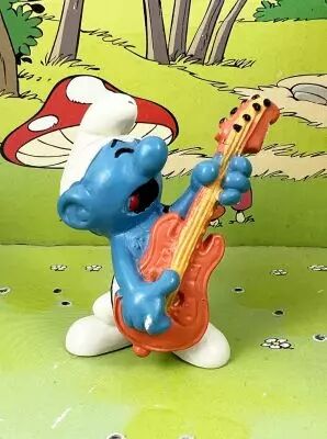Les Schtroumpfs - Schleich - 20023 Schtroumpf guitare basse (corps orange & cordes ocres)