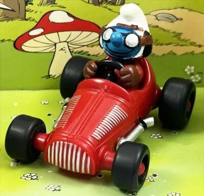 Les Schtroumpfs - Schleich - 40255 Schtroumpf avec voiture de course (rouge fonc�)