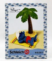 Les Schtroumpfs - Schleich - 40261 Schtroumpf bronzant sous le Cocotier (Boite New Look)