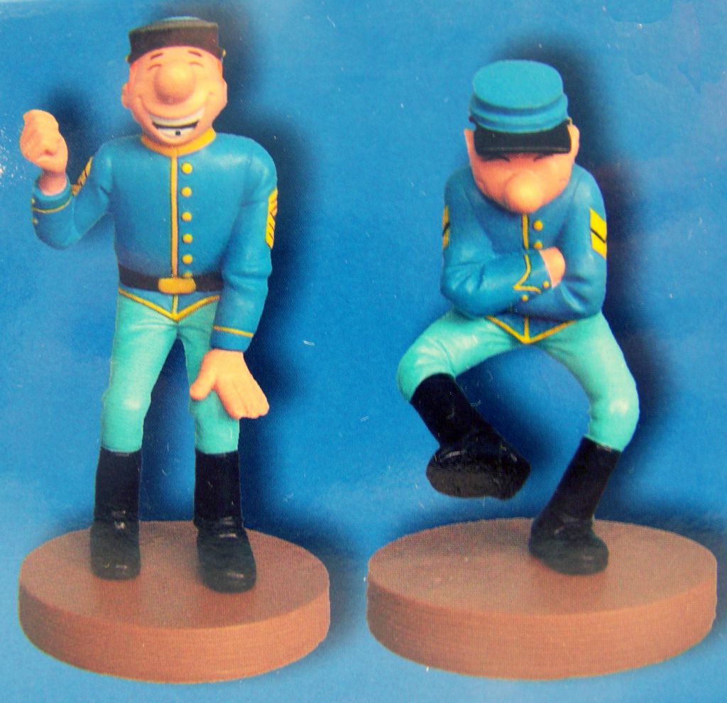 Figurine métal Tuniques Bleues Soldat assis cirant botte Les 