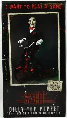 Saw - Billy la Poup�e avec Tricycle 30cm (Figurine parlante) - NECA