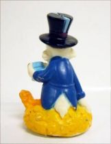 Scrooge - figure - Scrooge sat on his gold