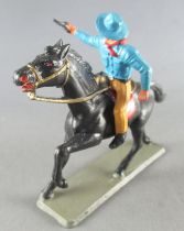 Starlux - Cow-Boys - Série 63 Luxe - Cavalier Tireur revolver main droite (bleu & jaune) cheval noir (réf 4414)