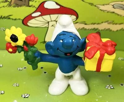 The Smurfs - Schleich - 20040 Smurf with present & flowers (Made in China)