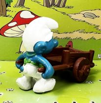 The Smurfs - Schleich - 40206 Smurf gardener with wheelbarrow (brown)