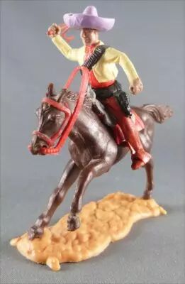 Timpo - Mexicains - Cavalier ceinture moul�e bras droit lev� veste jaune fouet pantalon marron sombrero mauve cheval brun galop