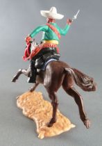 Timpo - Mexicains - Cavalier ceinture moulée bras droit levé veste verte révolver pantalon noir sombrero blanc cheval brun galop