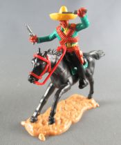 Timpo - Mexicains - Cavalier ceinture moulée bras gauche levé veste verte 2 révolvers jambes noires sombrero jaune cheval noir 