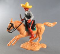 Timpo - Mexicains - Cavalier ceinture moulée tenant couteau veste grises jambes marron sombrero jaune cheval baie galop