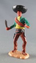 Timpo - Mexicans - Footed holding knife green jacket black hat brown legs with right foot pointing ahead