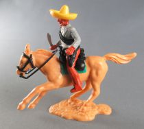 Timpo - Mexicans - Mounted (moulded belt) holding knive grey jacket brown legs yellow hat ligt brown galloping horse 