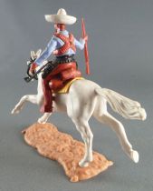 Timpo - Mexicans - Mounted (moulded belt) right arm pointing blue jacket (winchester) brown legs white hat white galloping (long