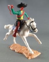 Timpo - Mexicans - Mounted (moulded belt) right arm raised green jacket (whip) brown legs black hat white galloping (long) horse