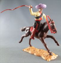 Timpo - Mexicans - Mounted (moulded belt) right arm raised yellow jacket (whip) brown legs lilac  hat dark brown galloping (long