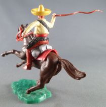 Timpo - Mexicans - Mounted (moulded belt) right arm raised yellow jacket (whip) brown legs yellow  hat dark brown galloping (sho