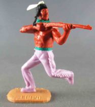 Timpo Indians 2nd series (moulded weapon) footed firing rifle lilac running legs white feather